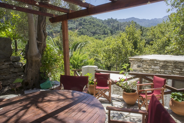 spacious terrace with view of the green Nightingale Valley and Mount Lazarus